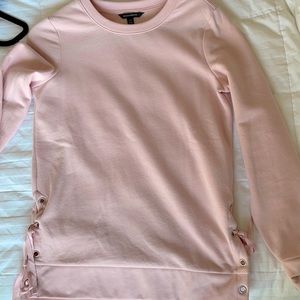 Pink crew neck sweater w ties on the side